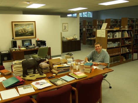Kevin Rau assisting in the Seminary library.